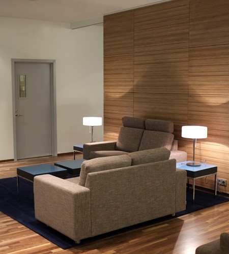 Plexwood® Iceland Air lounge wall cladding in sustainable meranti veneered wood on fire- retardant mdf