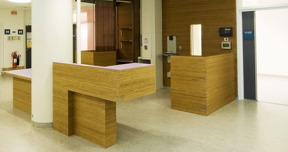 Plexwood® St. Olavs integrated open medical hospitality desk in pine re-clamped plytype safety composite veneers