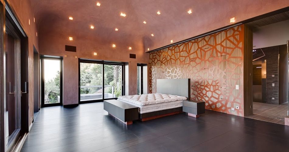 Plexwood® Bedroom back wall with integrated cabinet in design meranti veneer wood and copper panels