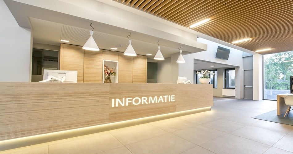 Plexwood® City hall of Montferland Didam entrance reception area and information desk with cabinets made of Plexwood Birch wood